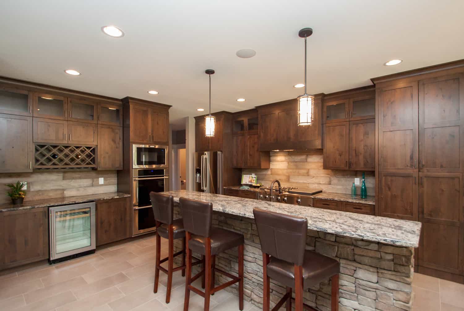 Kitchen: Breakfast Bar of this 5-Bedroom,5384 Sq Ft Plan -101-2016