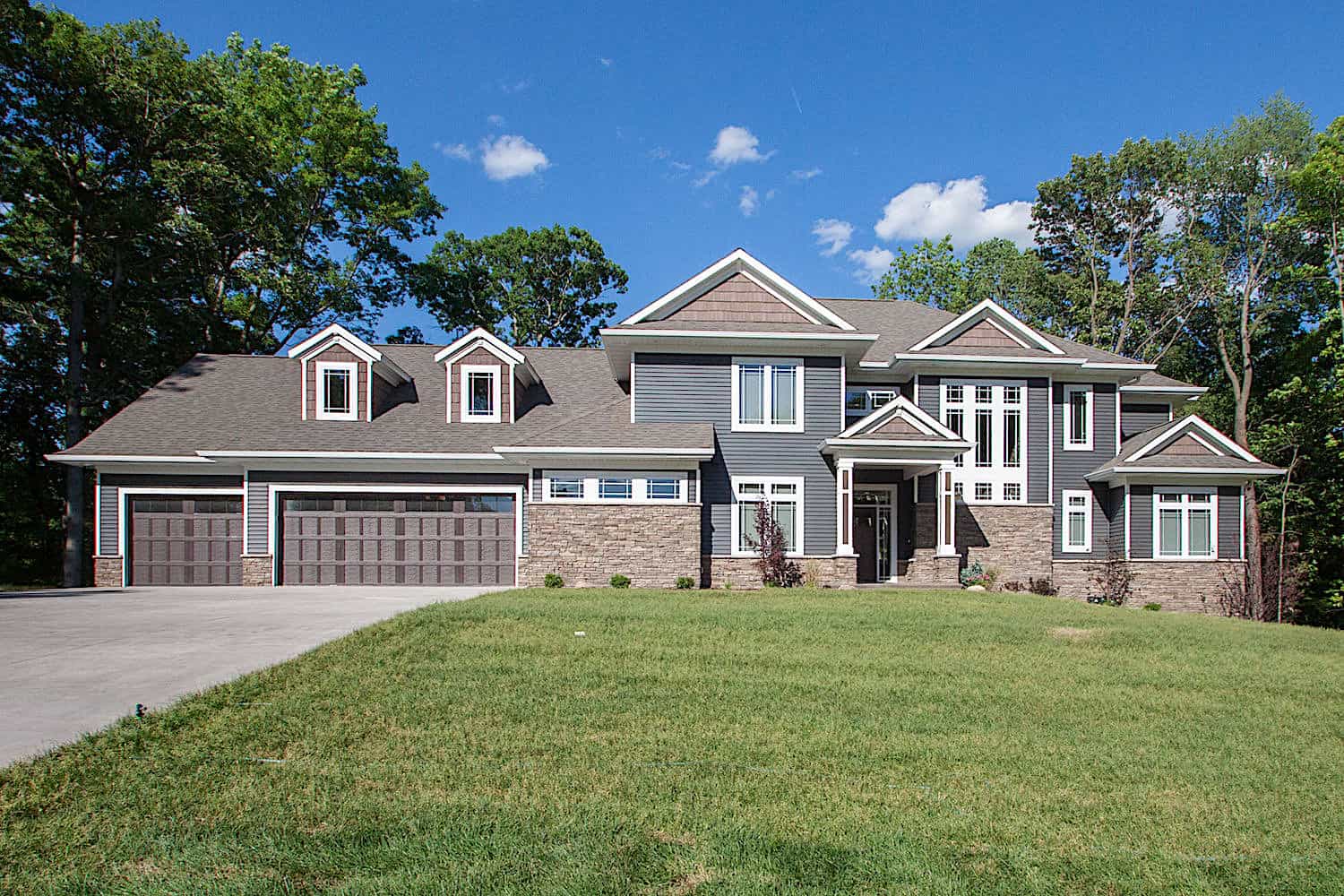 Front elevation of Luxury home (ThePlanCollection: House Plan #101-2016)