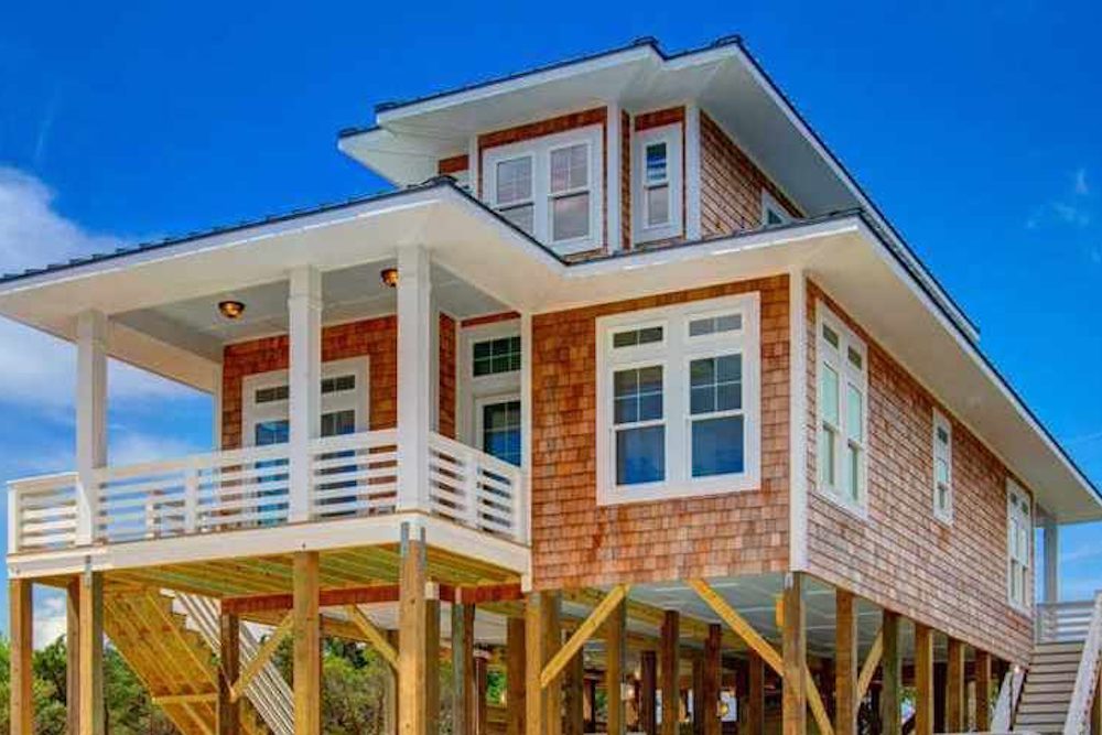 Front elevation of Beachfront home (ThePlanCollection: House Plan #116-1085)