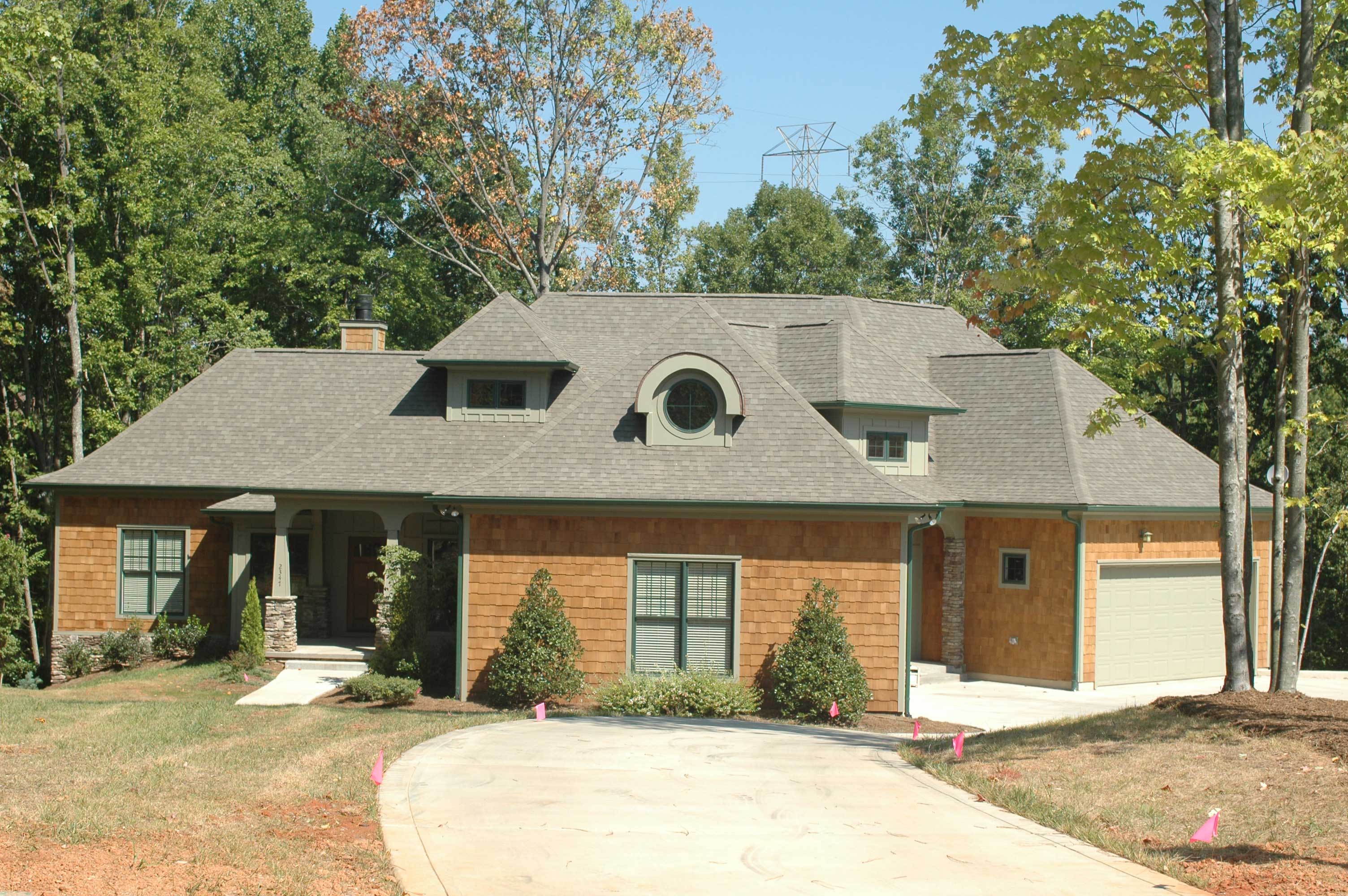 Front elevation of Craftsman home (ThePlanCollection: House Plan #127-1012)