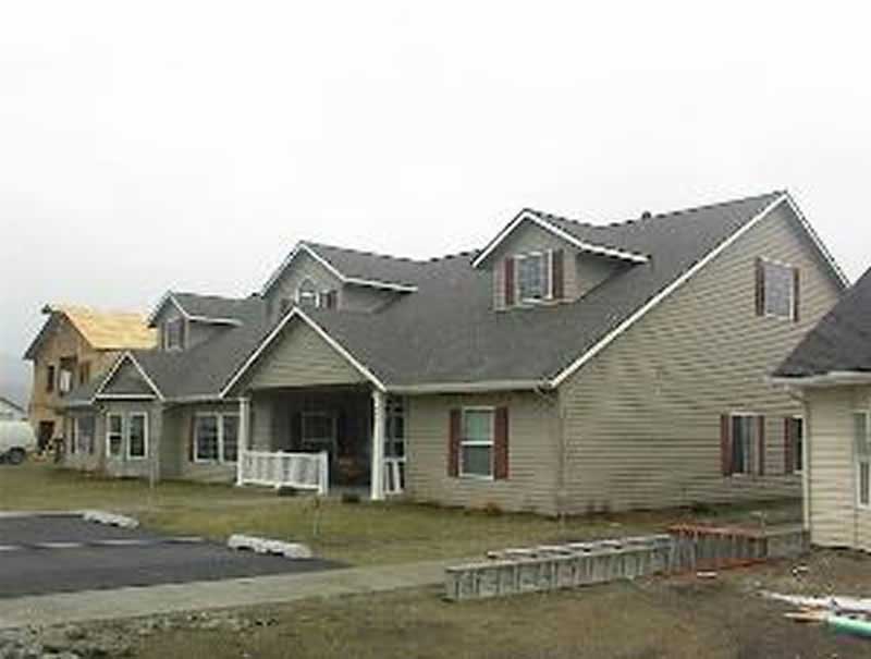 Front Elevation of this Multi-Unit House (#132-1389) at The Plan Collection.
