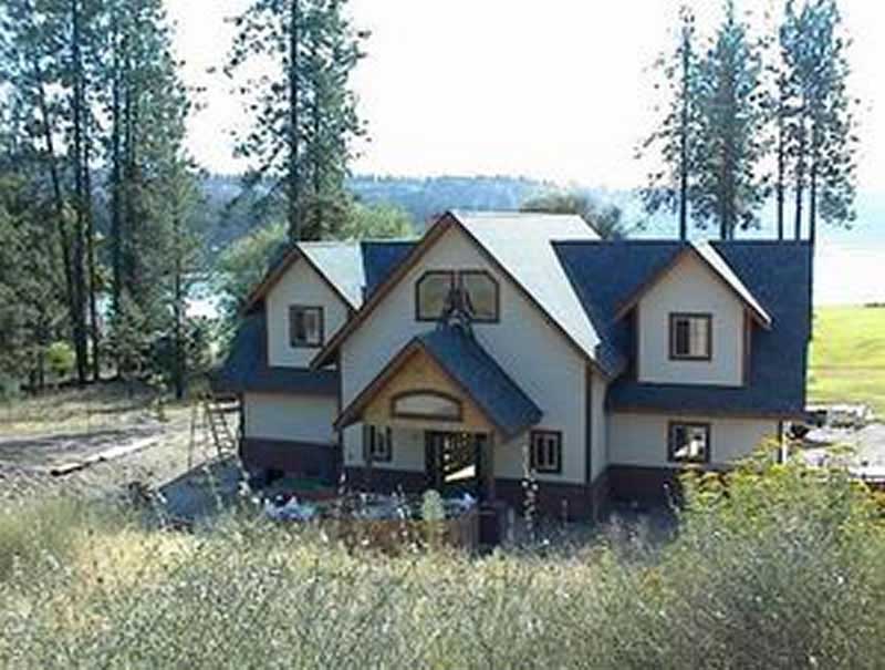 Front Elevation Photo of this Coastal House (#132-1421) at The Plan Collection.