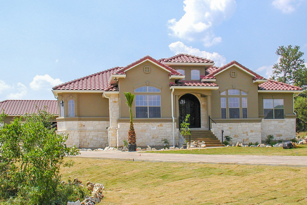 Front elevation of Mediterranean home (ThePlanCollection: House Plan #136-1012)