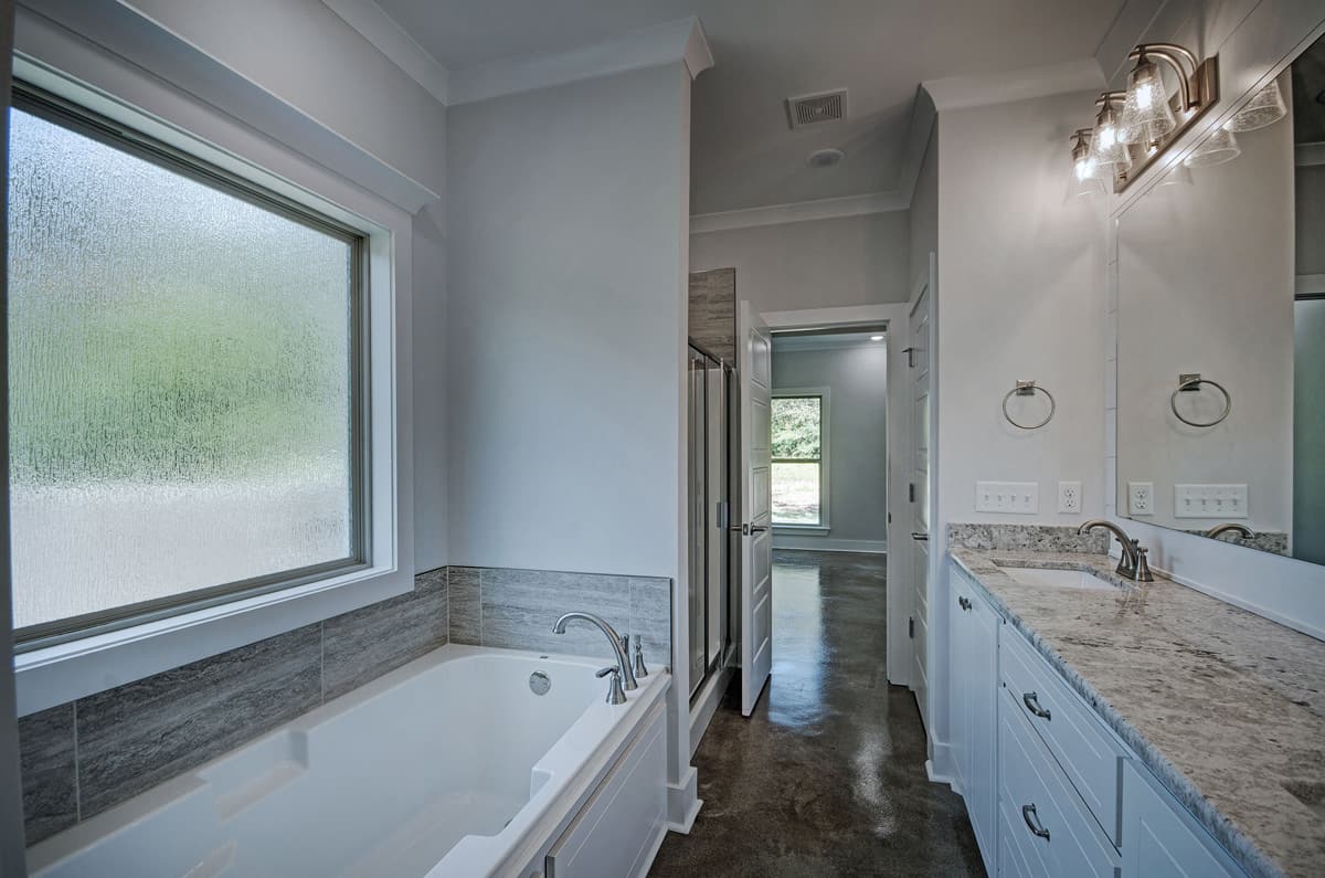 Master Bathroom: Tub of this 3-Bedroom,1581 Sq Ft Plan -1581