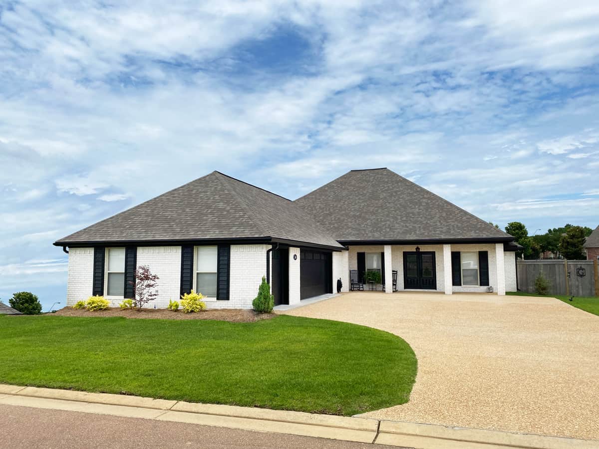 Front elevation of Acadian home (ThePlanCollection: House Plan #140-1128)