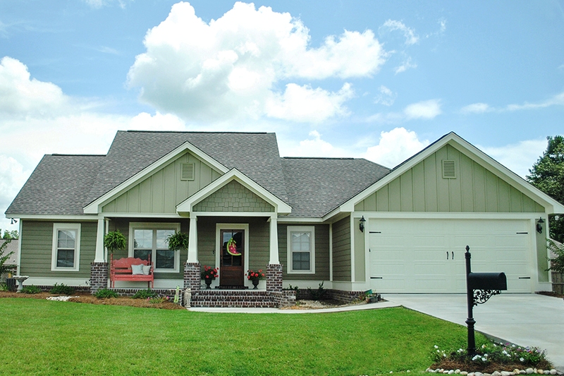 Front Elevation Photo of this Craftsman Cottage Home (#142-1067) at The Plan Collection.
