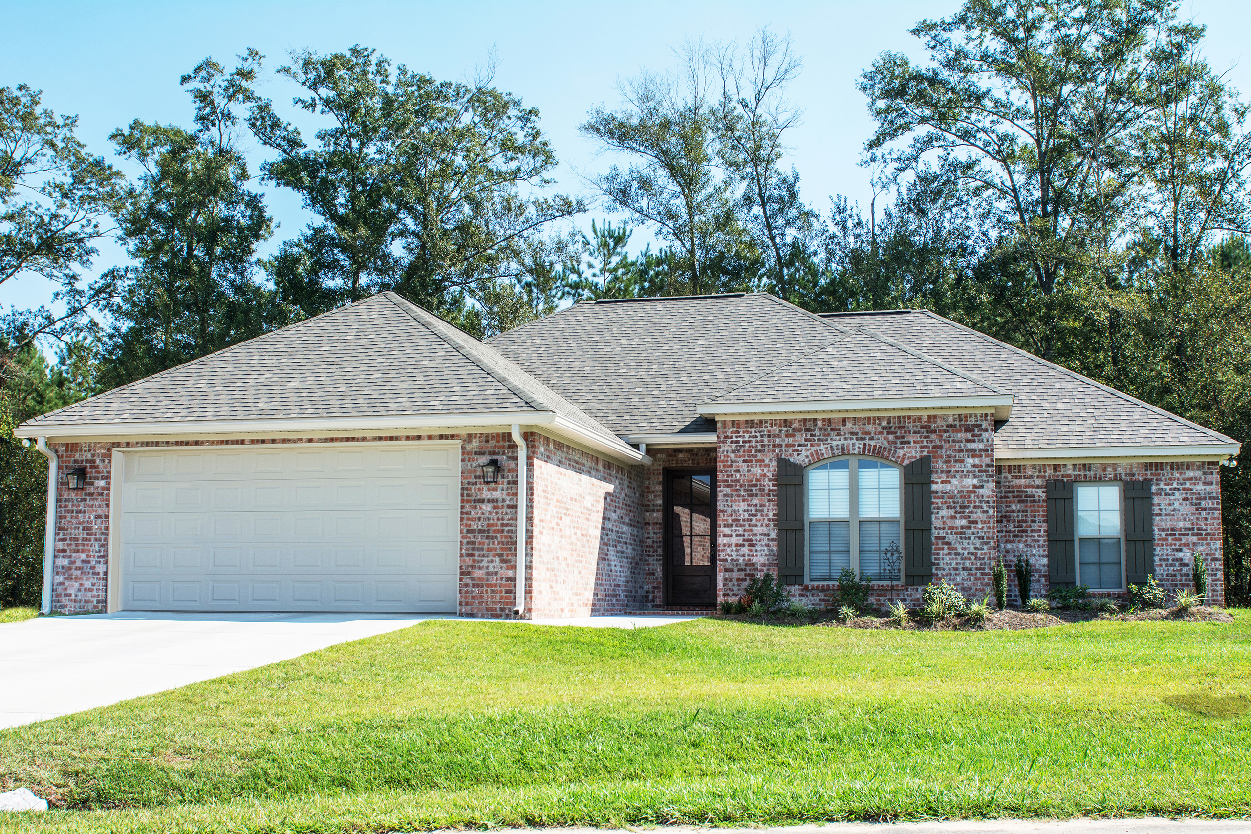 Front Elevation Photo of this French Style Ranch (#142-1081) at The Plan Collection.
