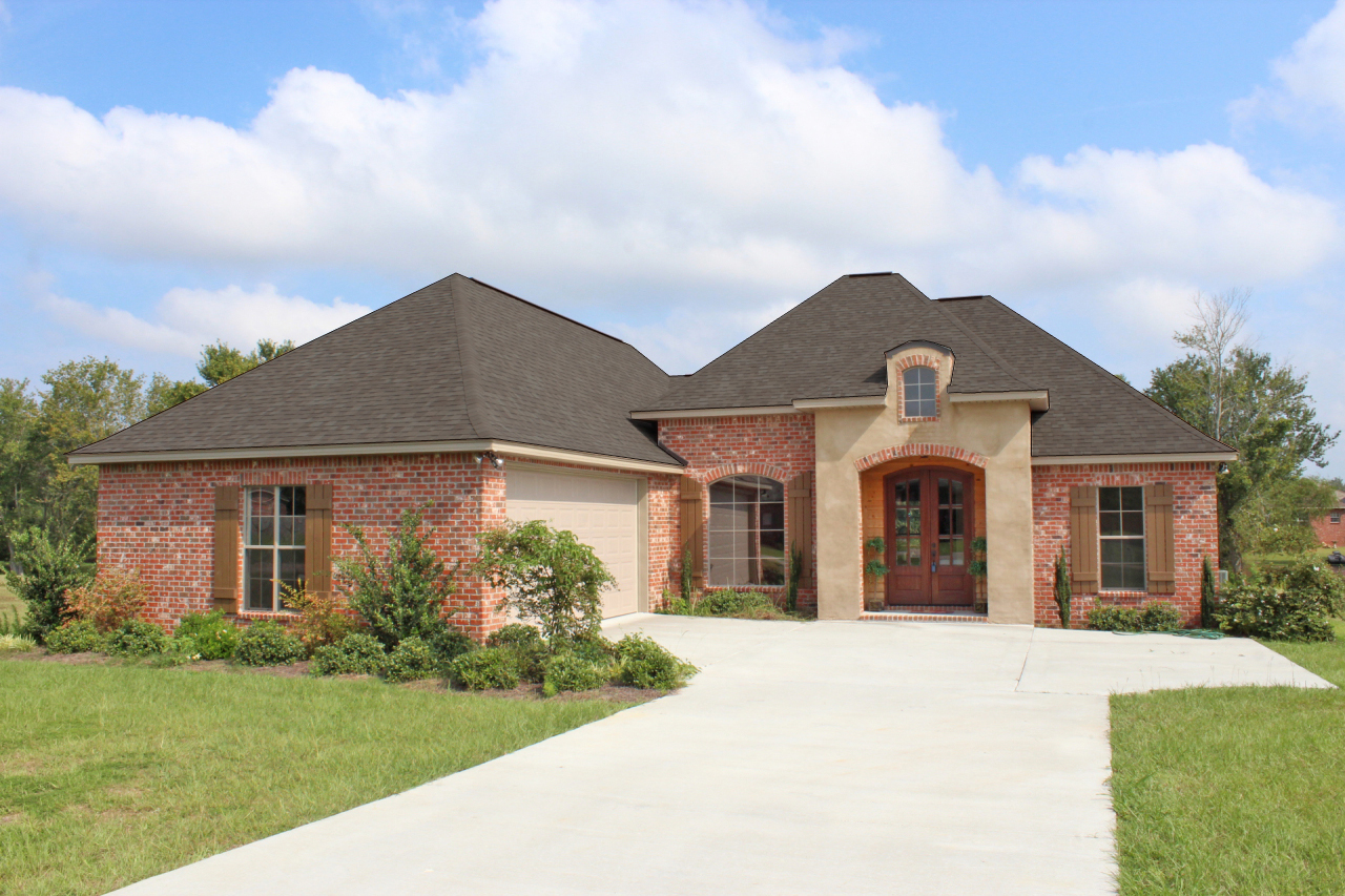 Front Elevation Photo of this Acadian House (#142-1090) at The Plan Collection.