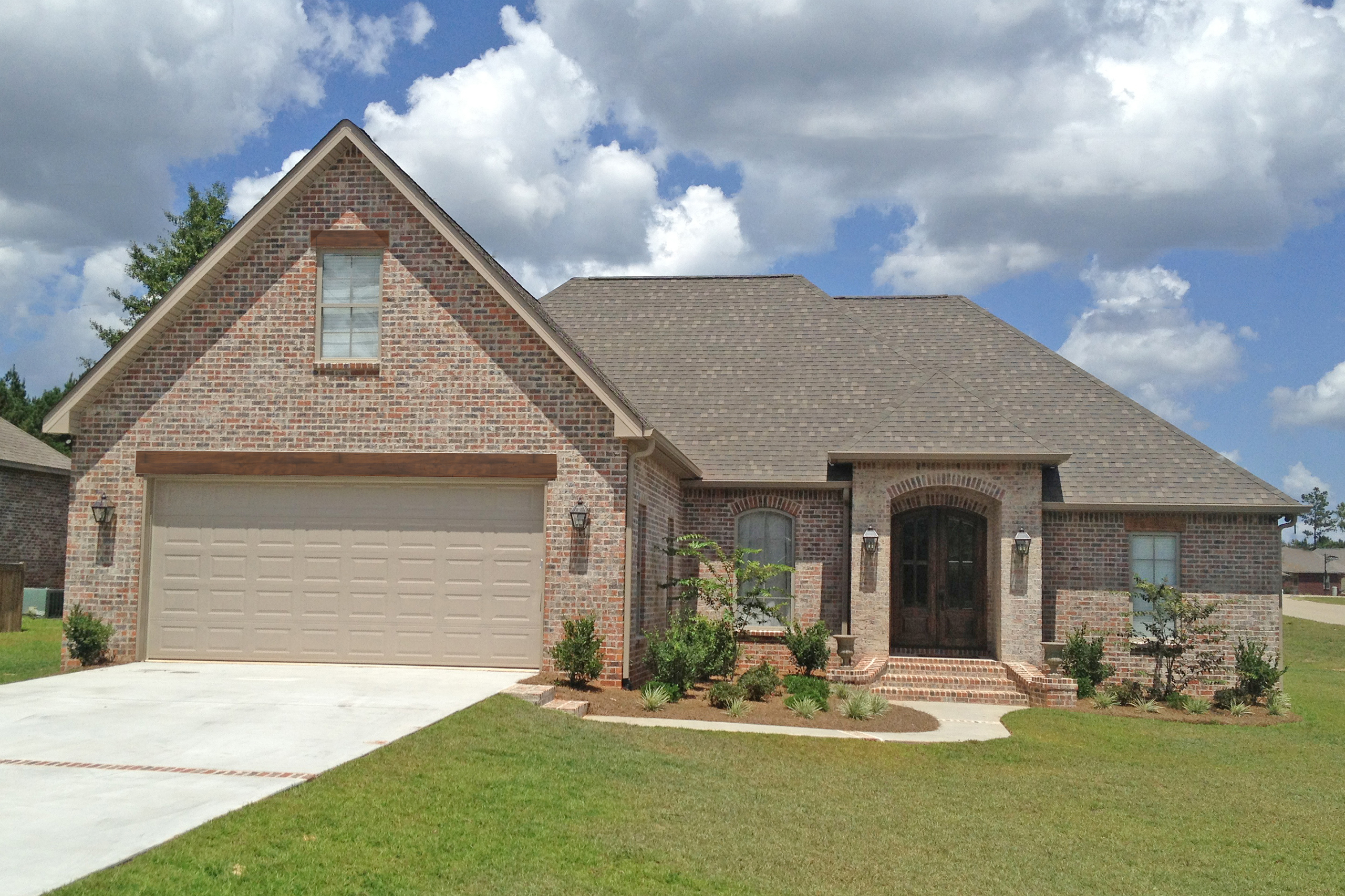 Front Elevation Photo of this French House (#142-1099) at The Plan Collection.