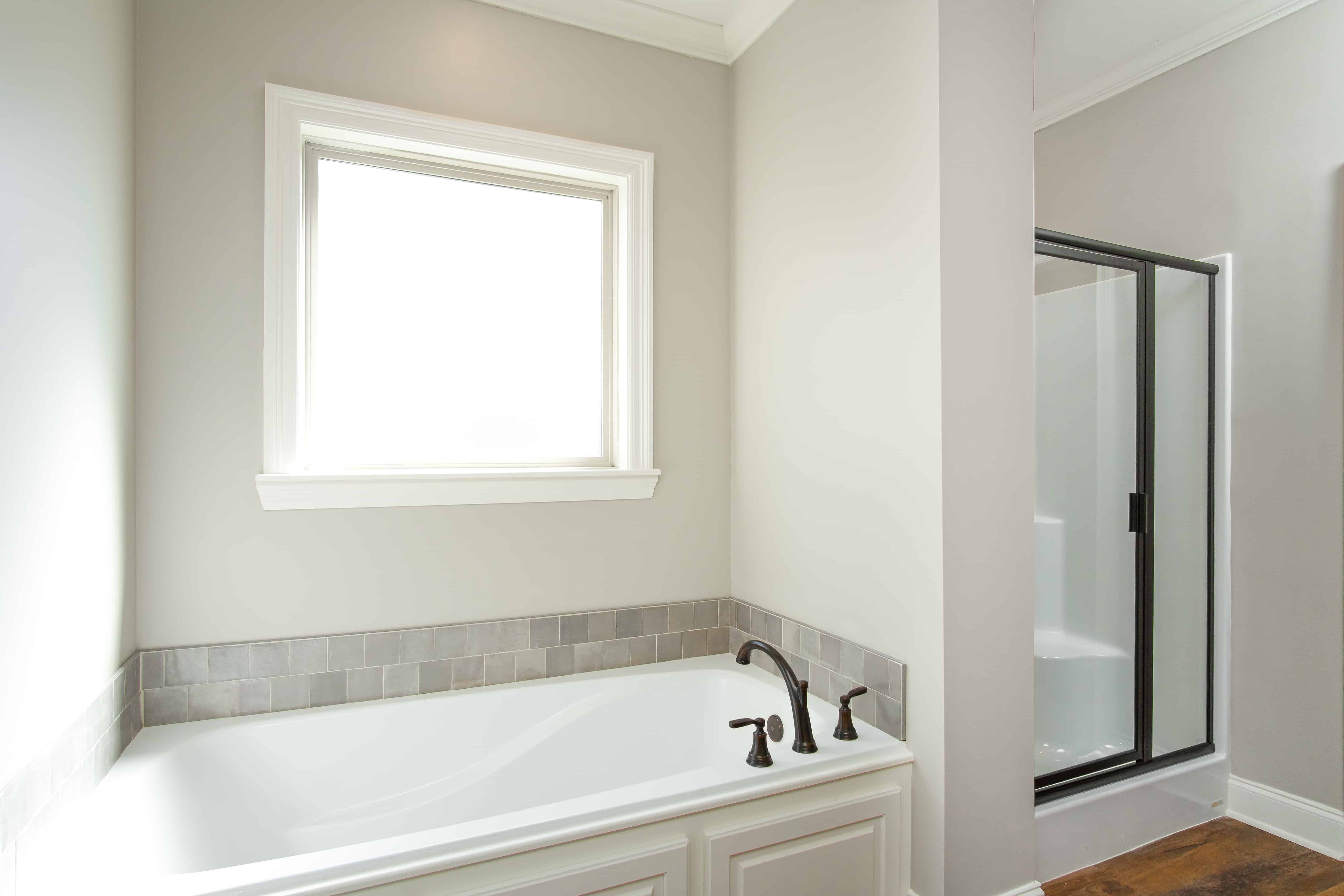 Master Bathroom: Tub of this 3-Bedroom,1450 Sq Ft Plan -142-1123