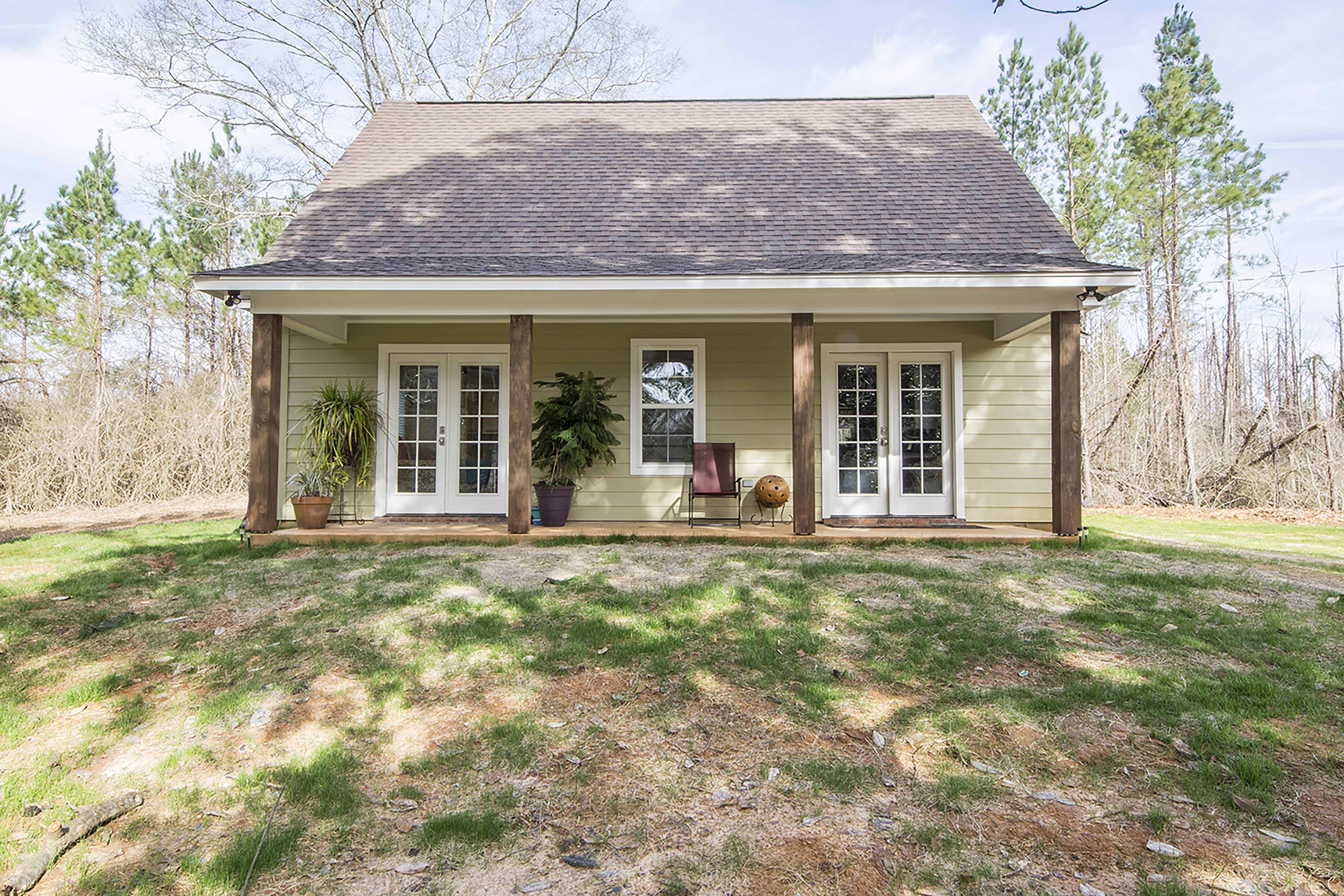 Front elevation of Farmhouse home (ThePlanCollection: House Plan #142-1423)