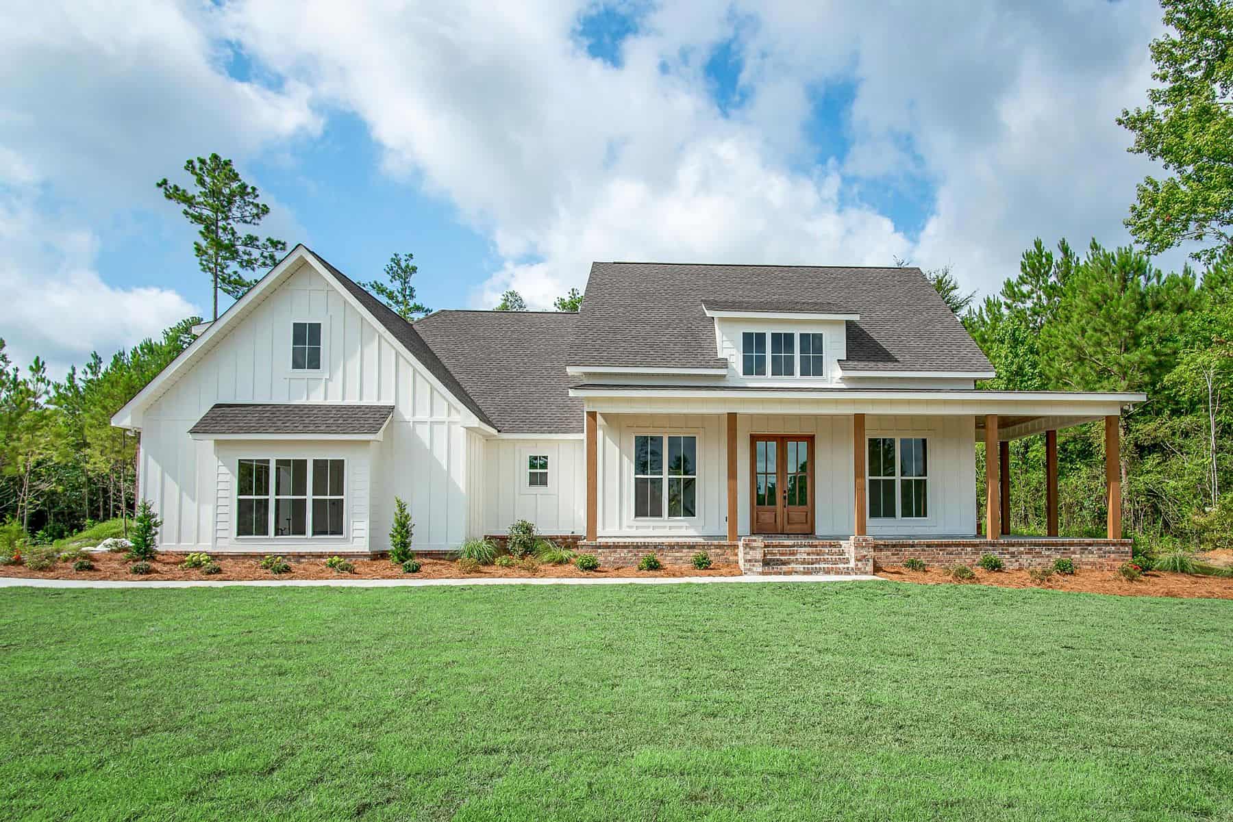 Front elevation of Farmhouse home (ThePlanCollection: House Plan #142-1447)