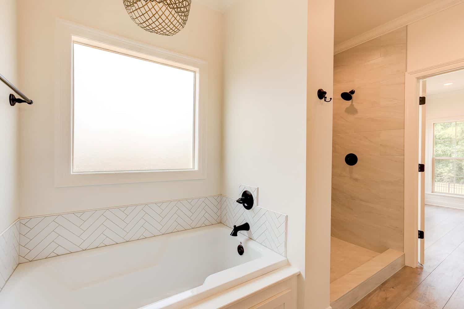 Master Bathroom: Tub of this 4-Bedroom,2004 Sq Ft Plan -142-1457