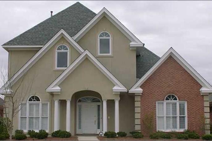 Color photograph of European home plan (ThePlanCollection: House Plan #144-1077)