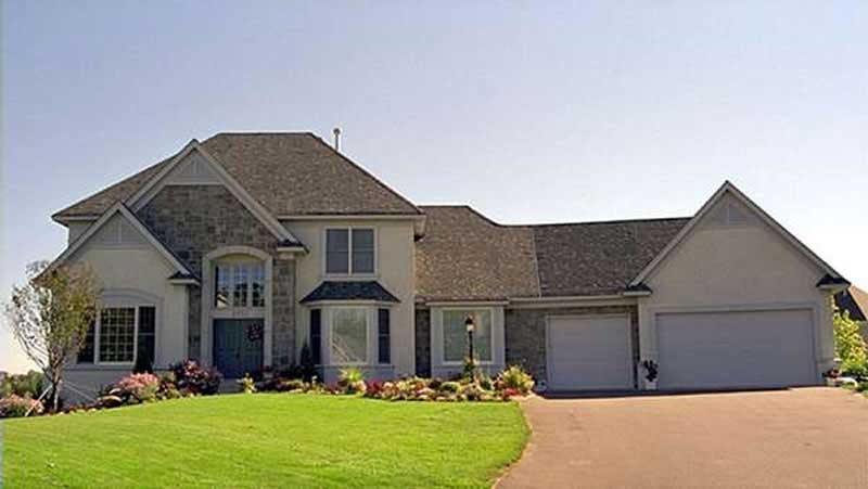 Front view of European home (ThePlanCollection: House Plan #146-1135)