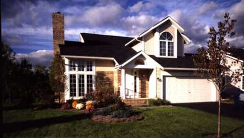 Front view of Country home (ThePlanCollection: House Plan #146-1353)