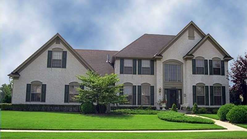 Front view of European home (ThePlanCollection: House Plan #146-2295)