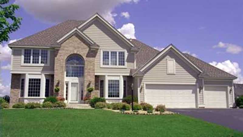 Front view of European home (ThePlanCollection: House Plan #146-2318)