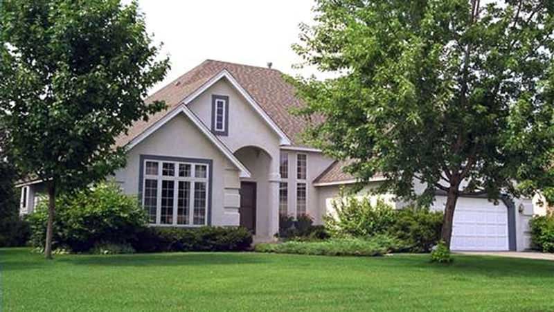 Front view of French home (ThePlanCollection: House Plan #146-2560)