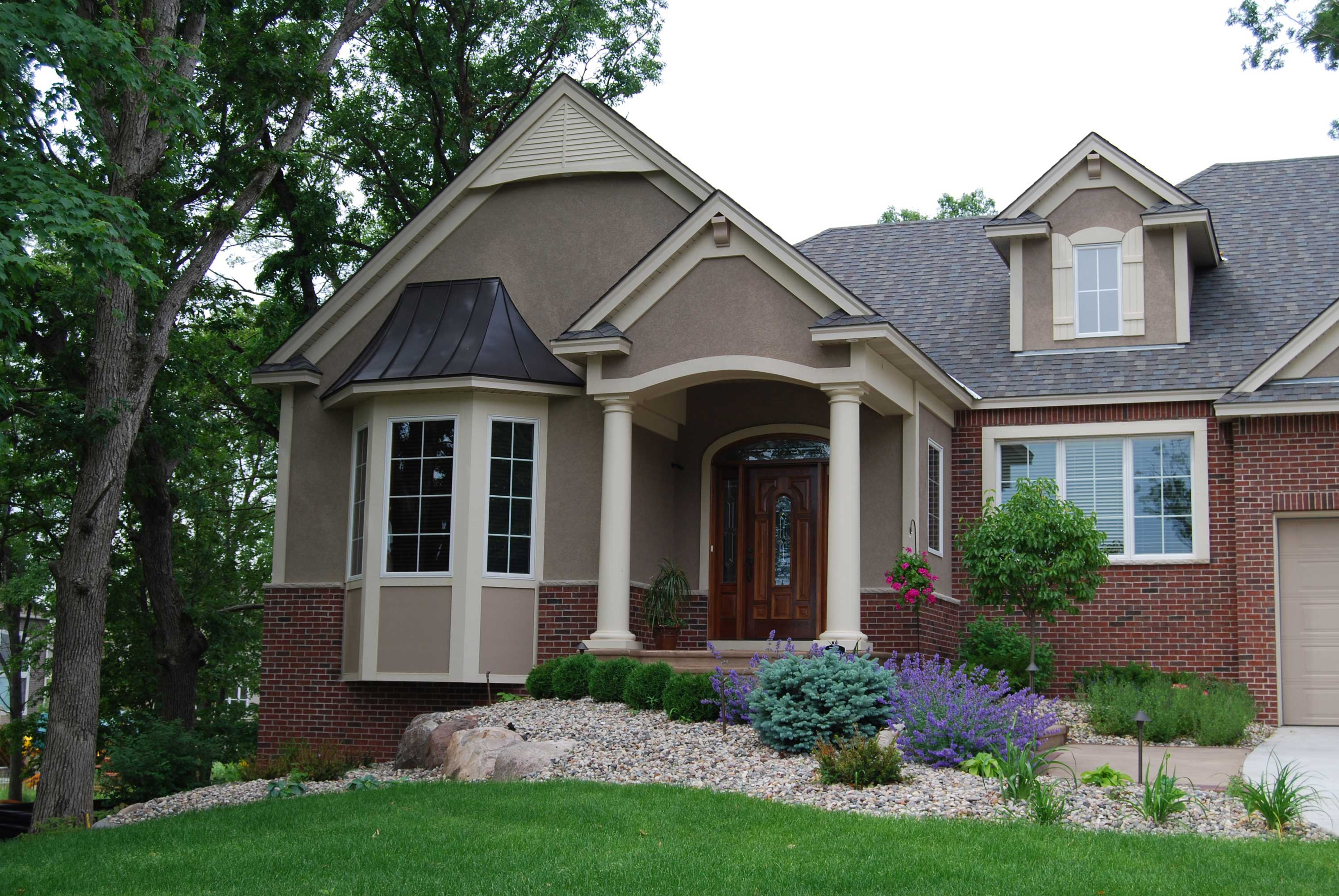 Front view of European home (ThePlanCollection: House Plan #146-2811)