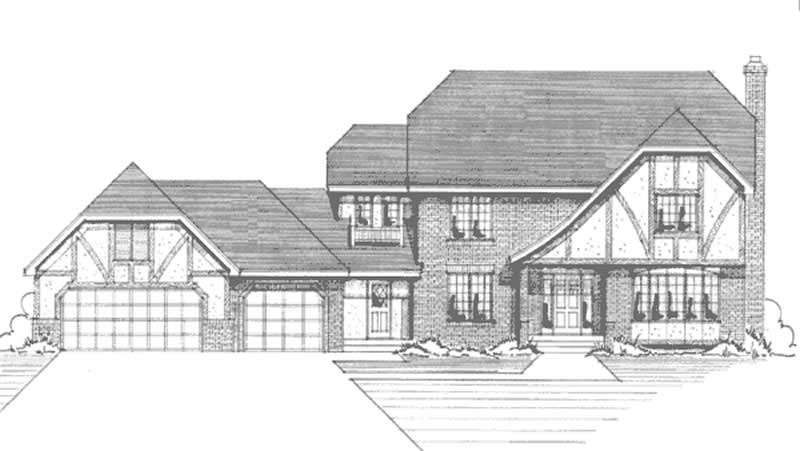 Front view of Tudor home (ThePlanCollection: House Plan #146-2880)