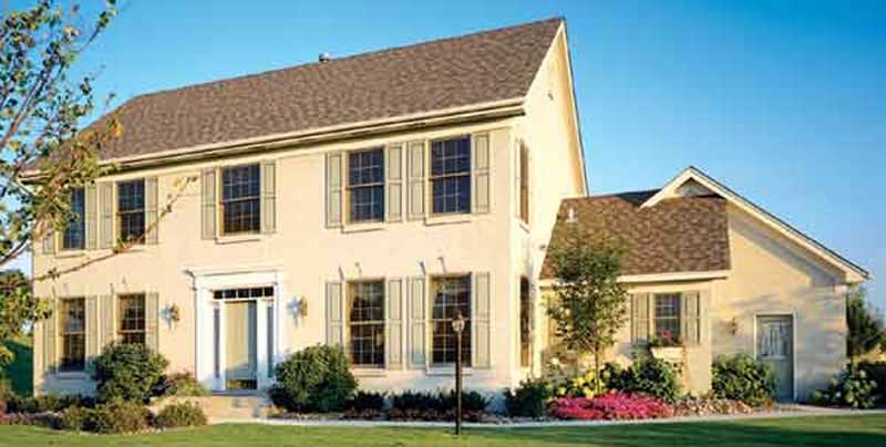 Front view of Colonial home (ThePlanCollection: House Plan #146-2920)
