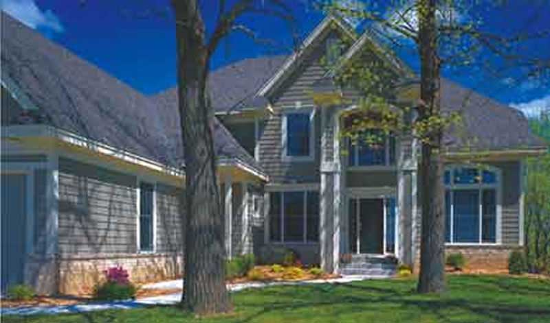 Front view of European home (ThePlanCollection: House Plan #146-2986)