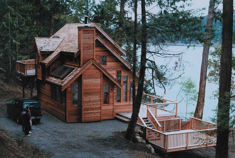 Front elevation of Log Cabin home (ThePlanCollection: House Plan #160-1009)