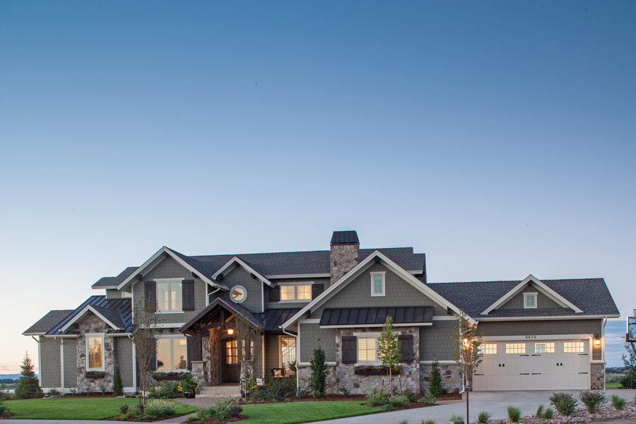 Front elevation of Luxury home (ThePlanCollection: House Plan #161-1067)