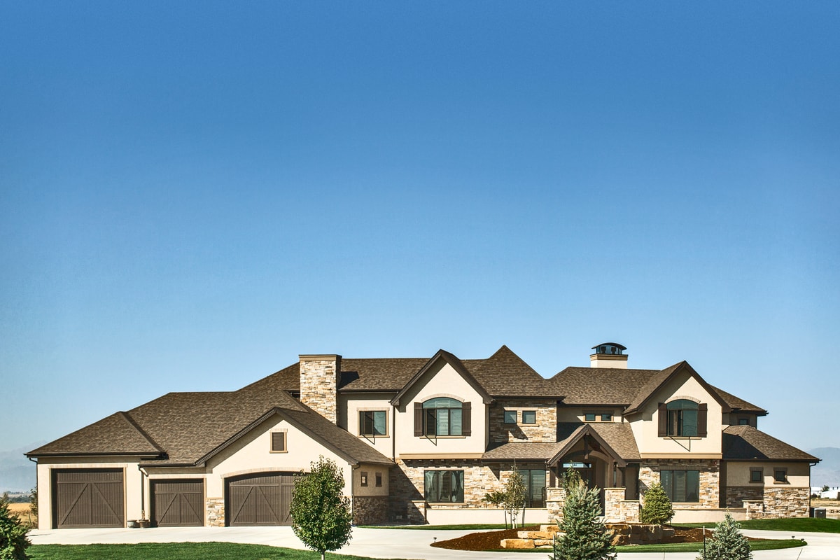 Front elevation of Luxury home (ThePlanCollection: House Plan #161-1071)
