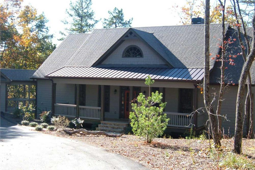 Color photograph of Country home plan (ThePlanCollection: House Plan #163-1009)