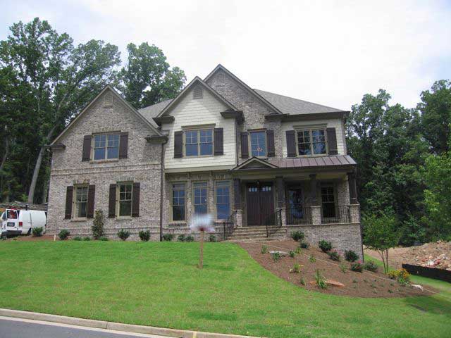 Front elevation of Country home (ThePlanCollection: House Plan #163-1034)