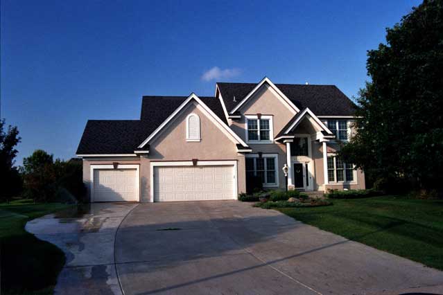 This color photo shows the front elevation of Country House Plans CLS-2306.