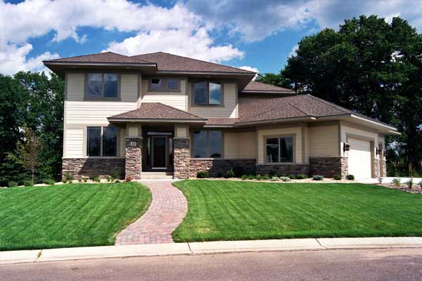 Front elevation of European home (ThePlanCollection: House Plan #165-1048)