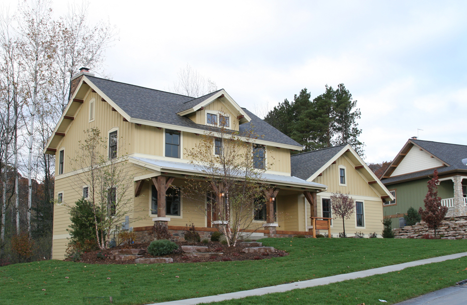 This is a colored front photo for these Craftsman House plans.