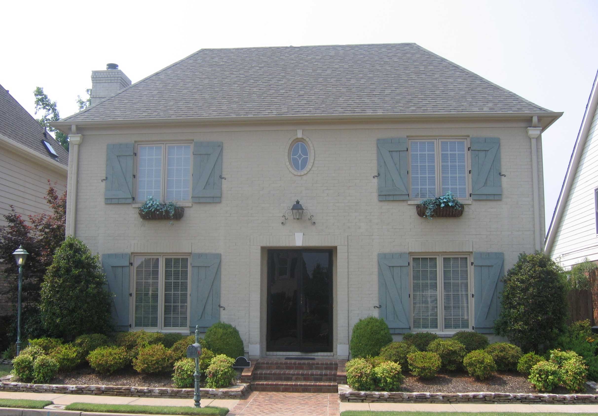 Front view of French home (ThePlanCollection: House Plan #170-1279)