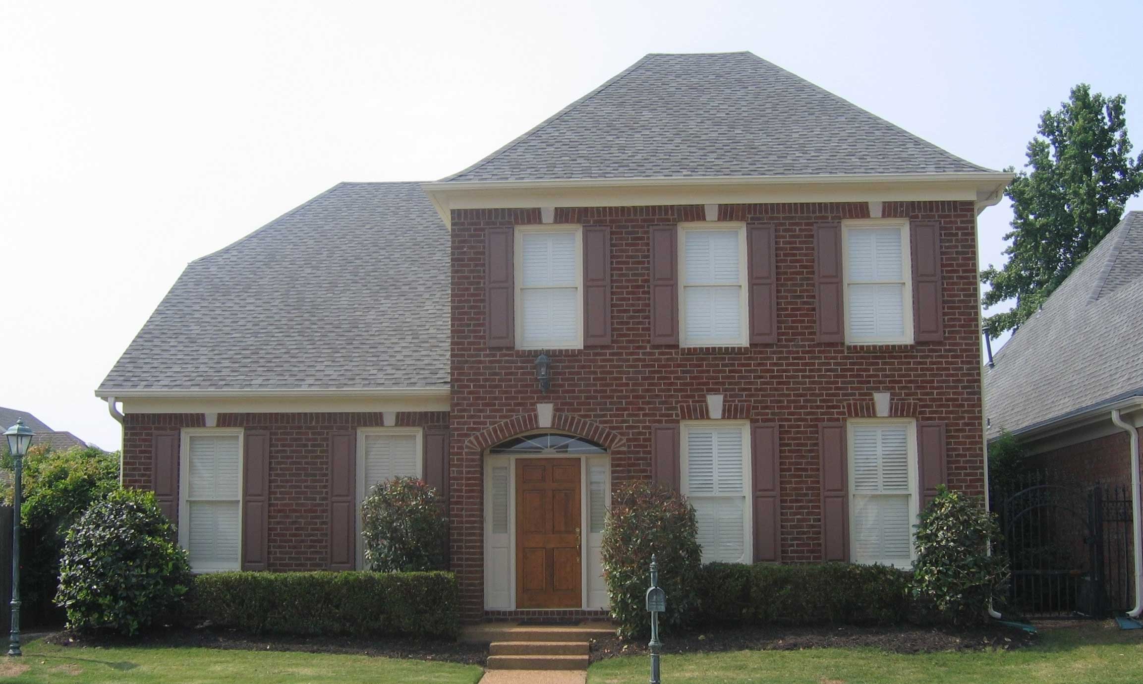 Front view of French home (ThePlanCollection: House Plan #170-1388)