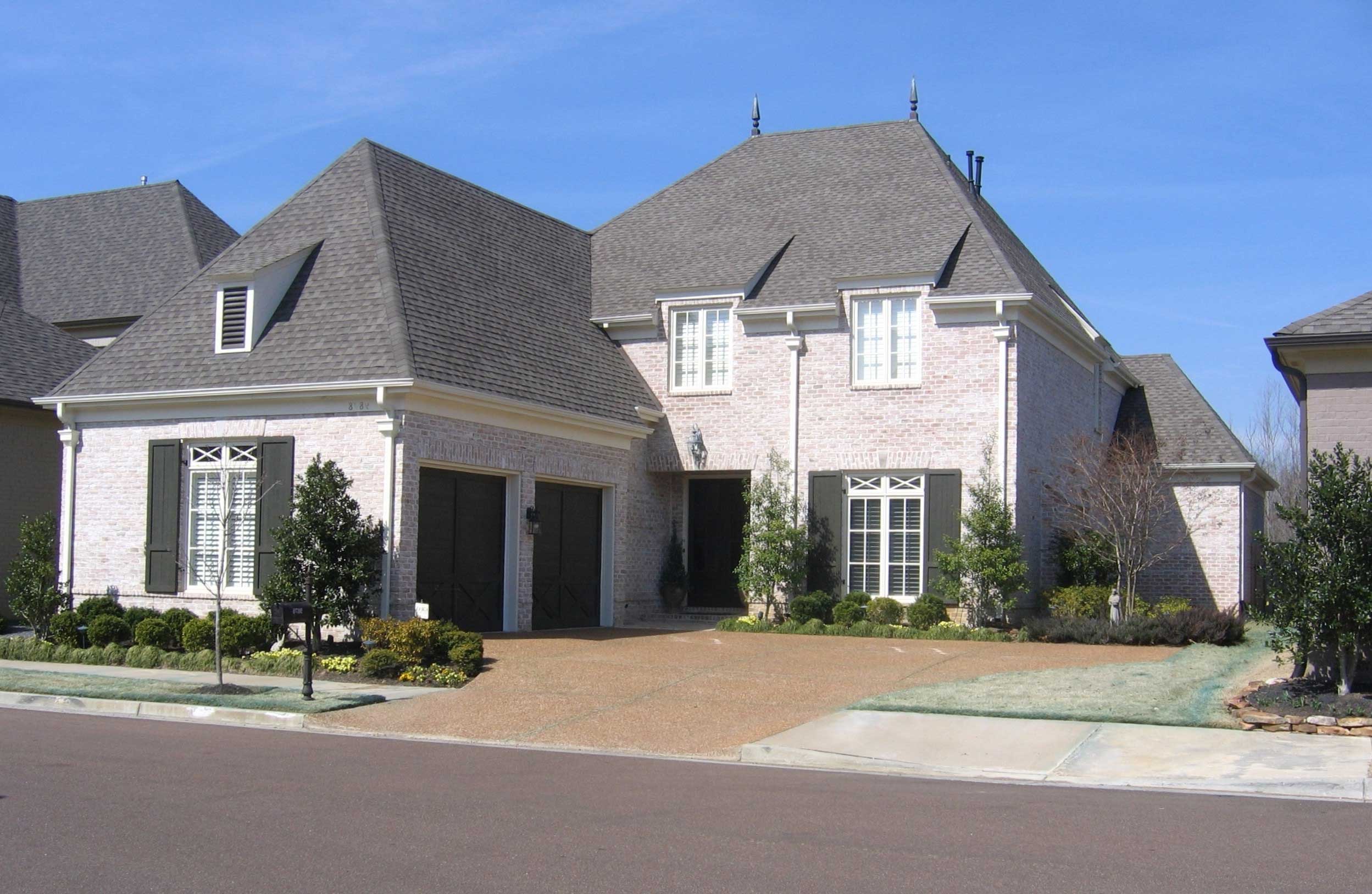 Front view of French home (ThePlanCollection: House Plan #170-1399)