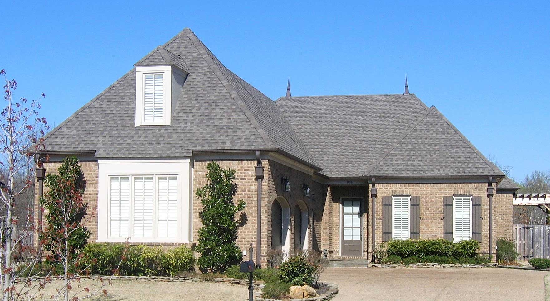 Front view of French home (ThePlanCollection: House Plan #170-1490)