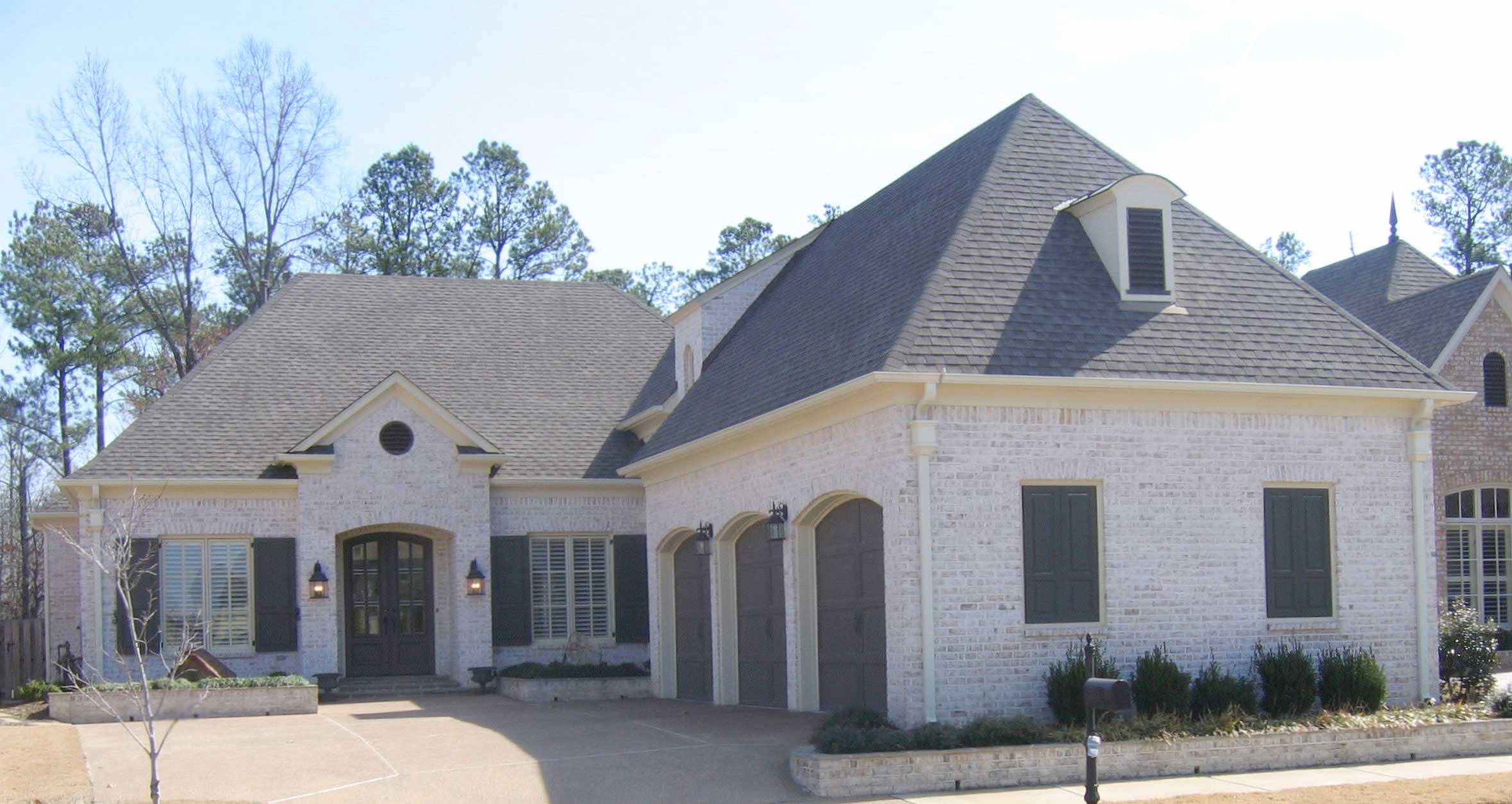 Front view of French home (ThePlanCollection: House Plan #170-1509)