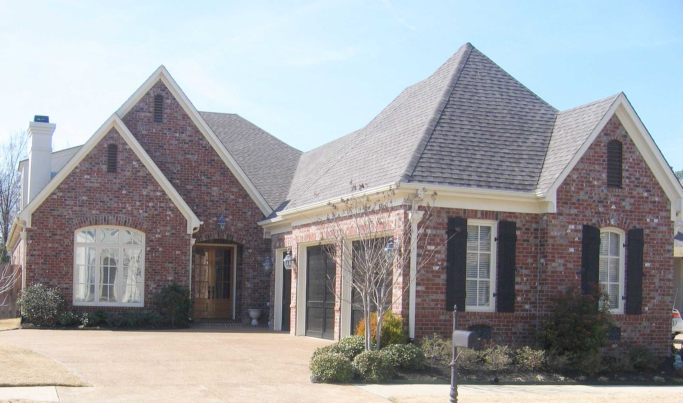 Front view of French home (ThePlanCollection: House Plan #170-1644)