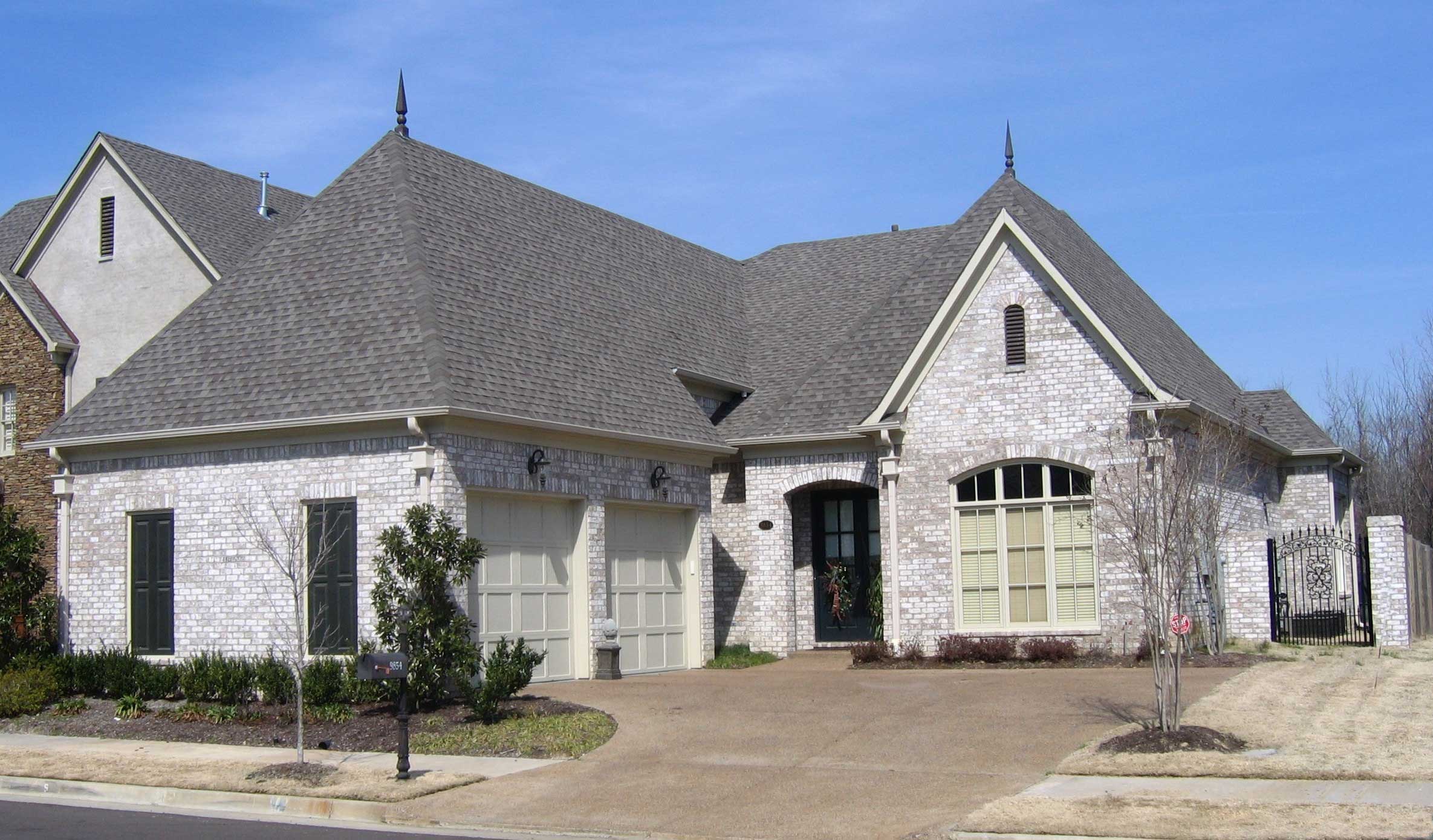 Front view of French home (ThePlanCollection: House Plan #170-1678)