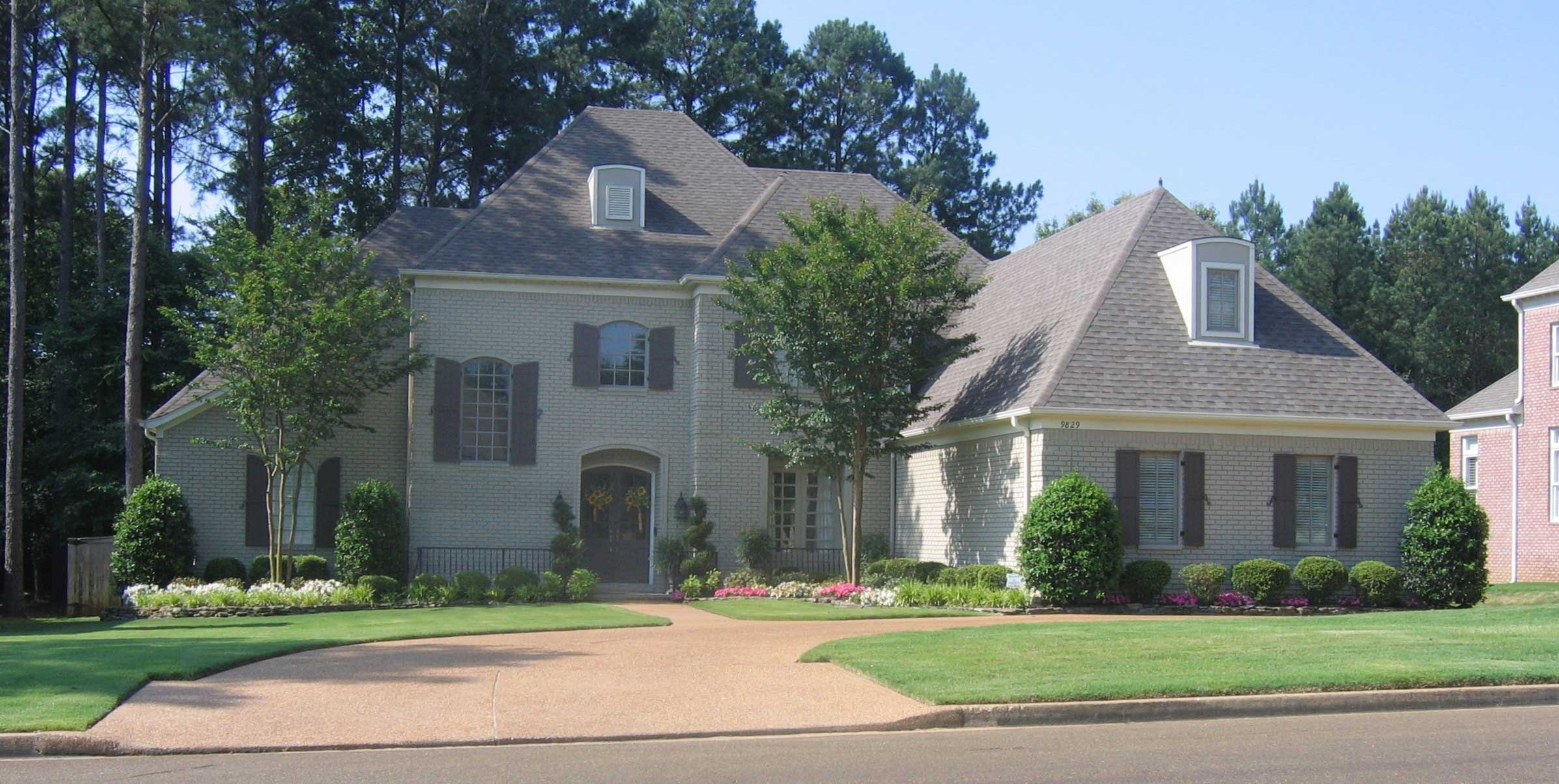 Front view of French home (ThePlanCollection: House Plan #170-1718)