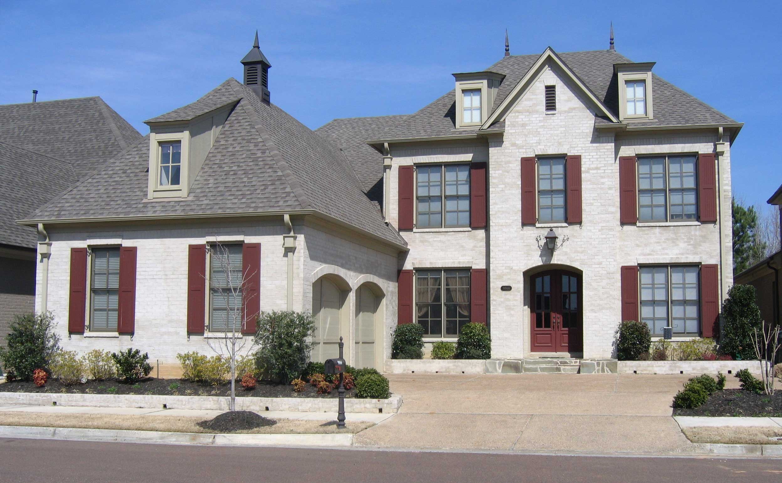 Front view of French home (ThePlanCollection: House Plan #170-1741)