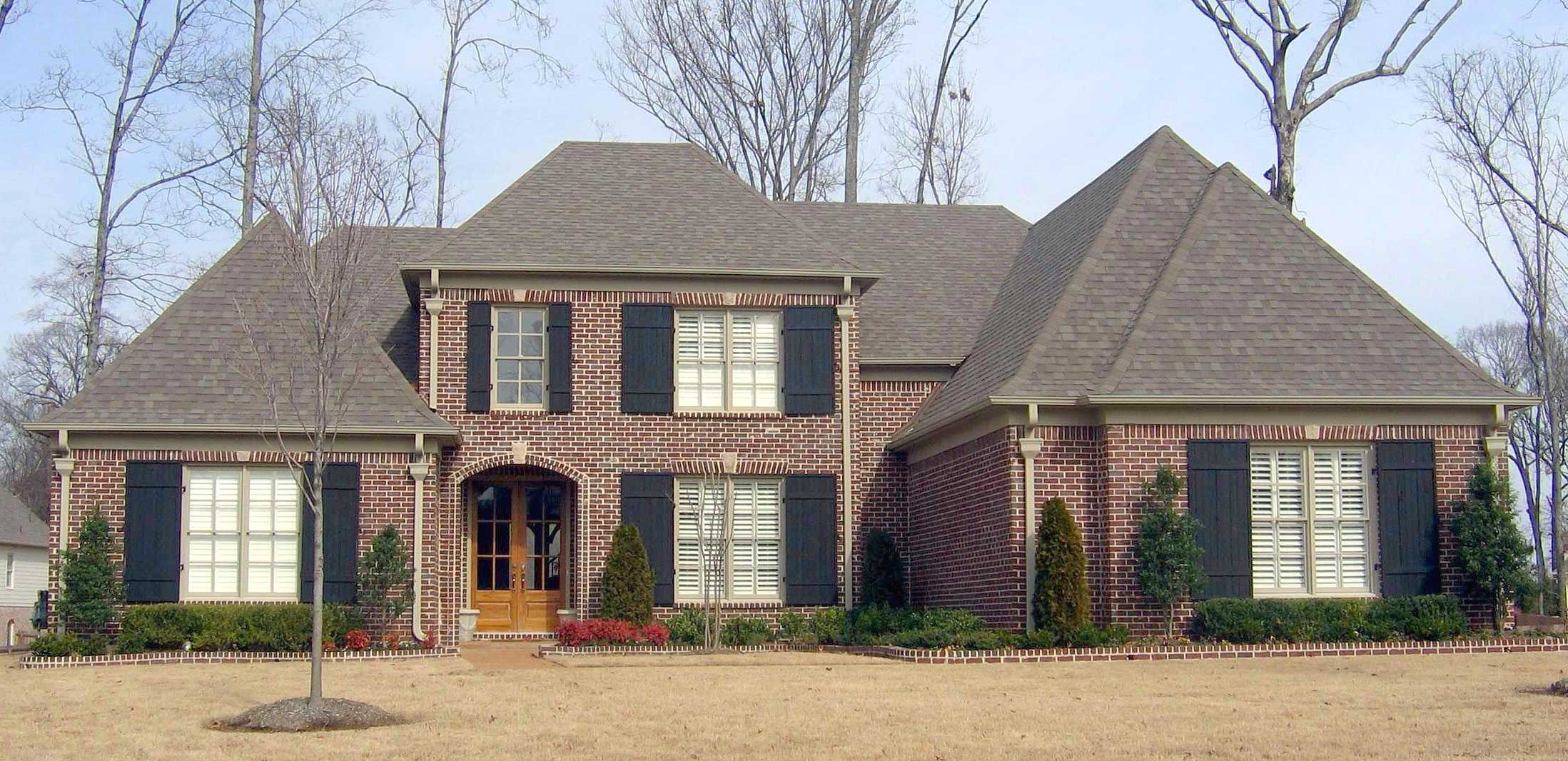 Front view of French home (ThePlanCollection: House Plan #170-1751)
