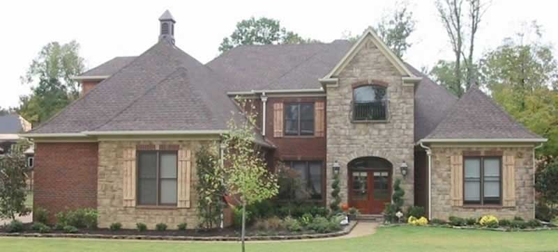 Front view of French home (ThePlanCollection: House Plan #170-2056)
