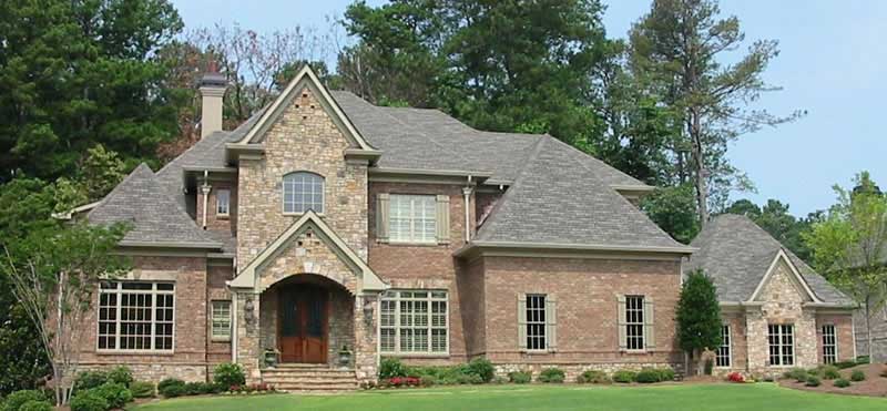 Front view of French home (ThePlanCollection: House Plan #170-2463)