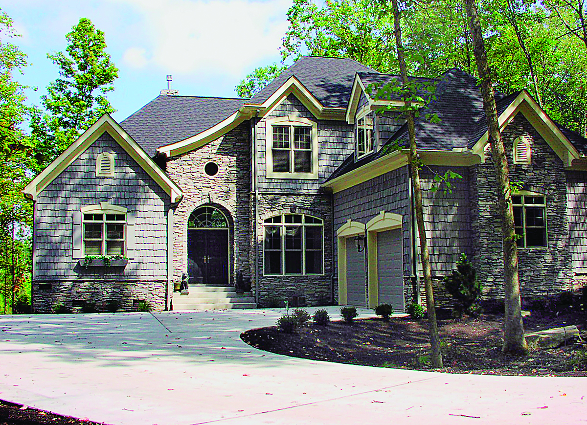 Front elevation of country Craftsman home (ThePlanCollection: House Plan #180-1009)