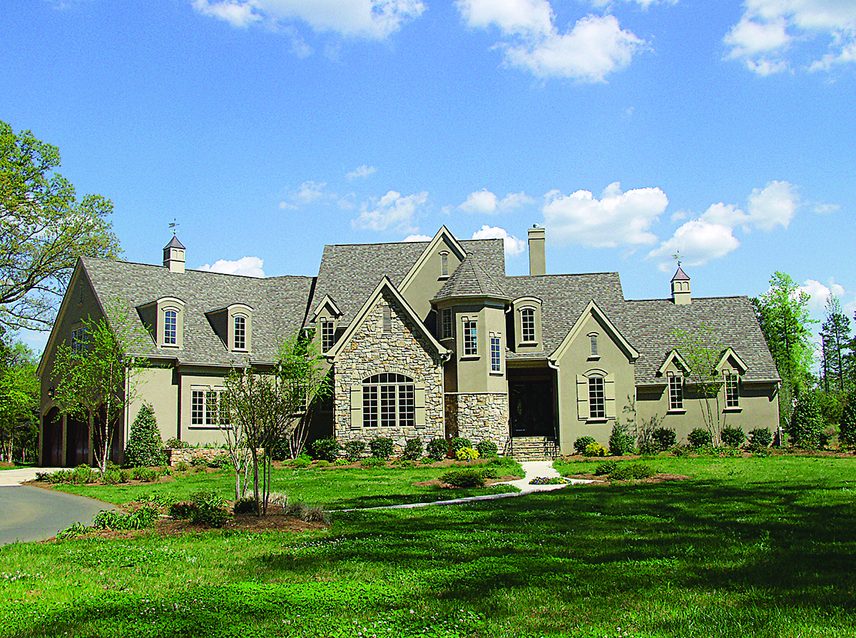 Photo of this French country manor (ThePlanCollection: House Plan #180-1015)