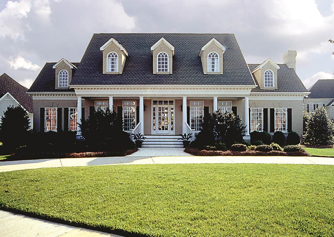 Photo of this classic Southern plantation-style home (ThePlanCollection: House Plan #180-1018)